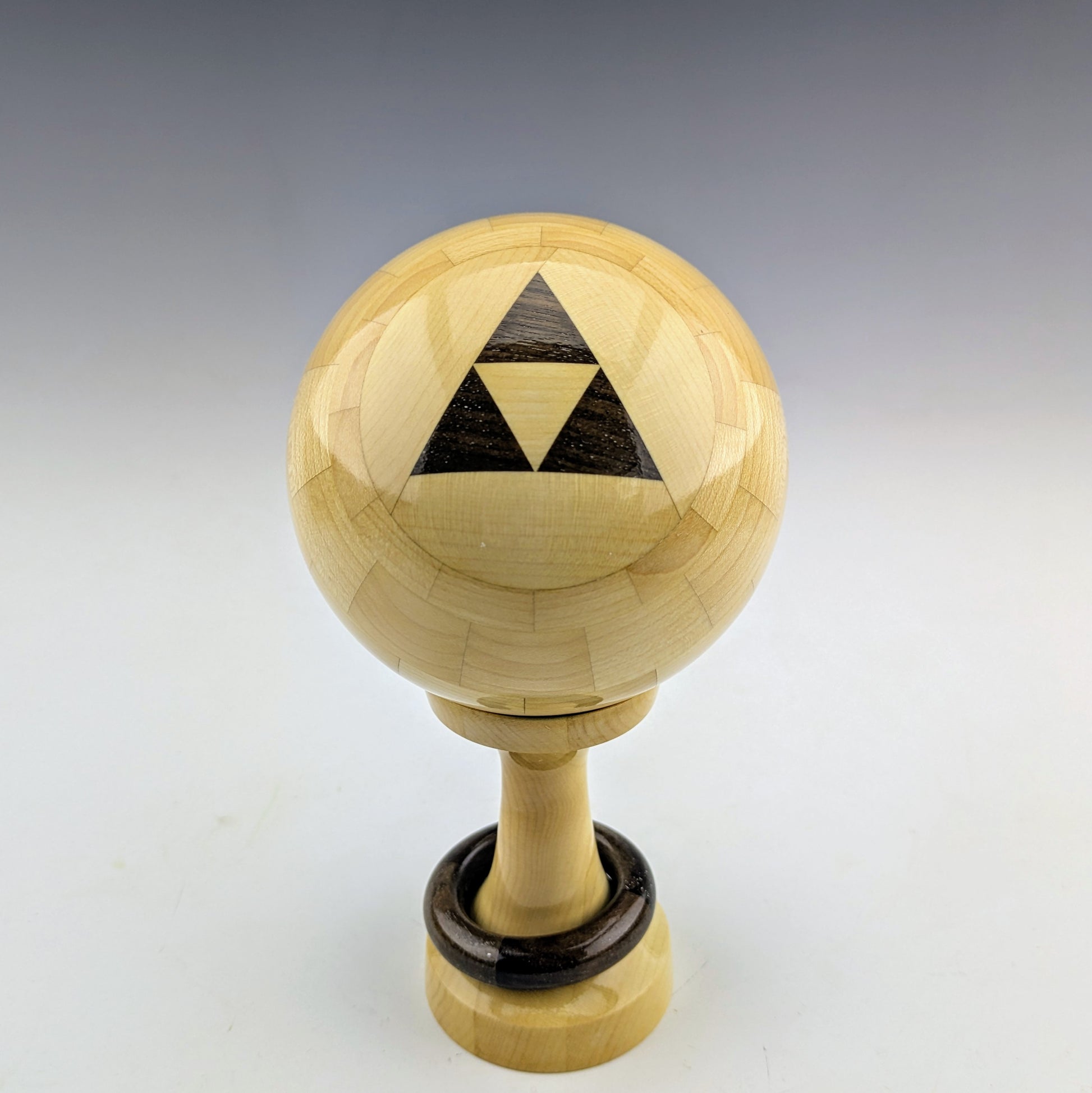 Maple threaded sphere box with a walnut captive ring. Handcrafted in Canada by roysbox