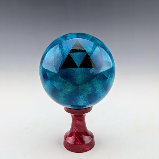 Blue Ball Box on a red stand. Handcrafted in Canada with maple and walnut. roysbox.com