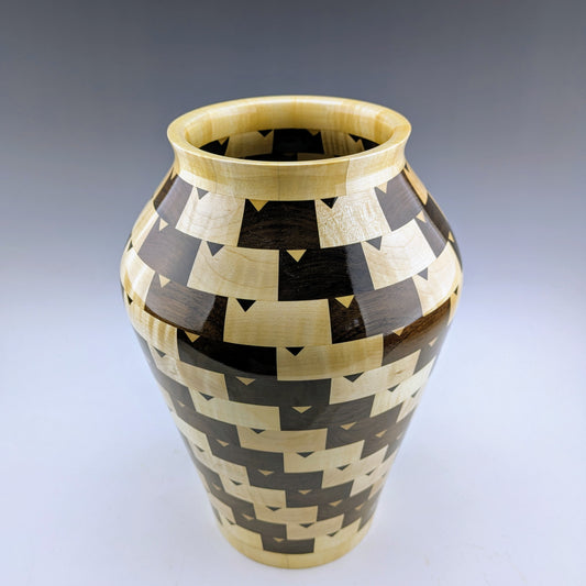 Black and White segmented vase by Simon Roy. Handcrafted in Canada from peruvian walnut and maple