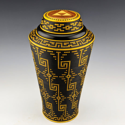 Pixel Art Vase by Simon Roy. Made of maple, ebiara, yellowheart and india ink. Features 2 hidden compartments, one inside the threaded lid and another screwed in the bottom. Handcrafted in Canada by roysbox