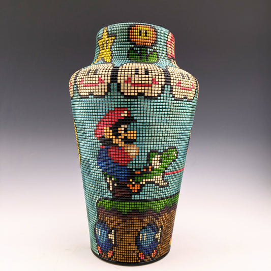 Pixelated Vase featuring Nintendo characters. Segmented maple, textured and inked one pixel at a time by a very patient Canadian craftsman. hidden compartment inside.