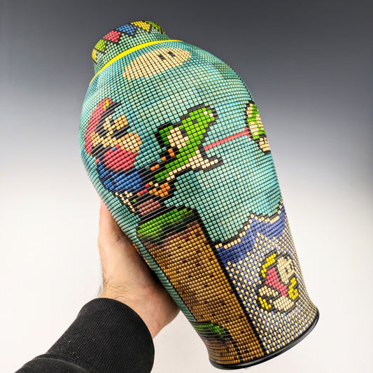 Pixelized Vase with Mario Bros and friends, made of segmented maple, textures and inked. Features a hidden compartment inside the lid and beautiful exotic woods inlays. Handmade in Canada by roysbox