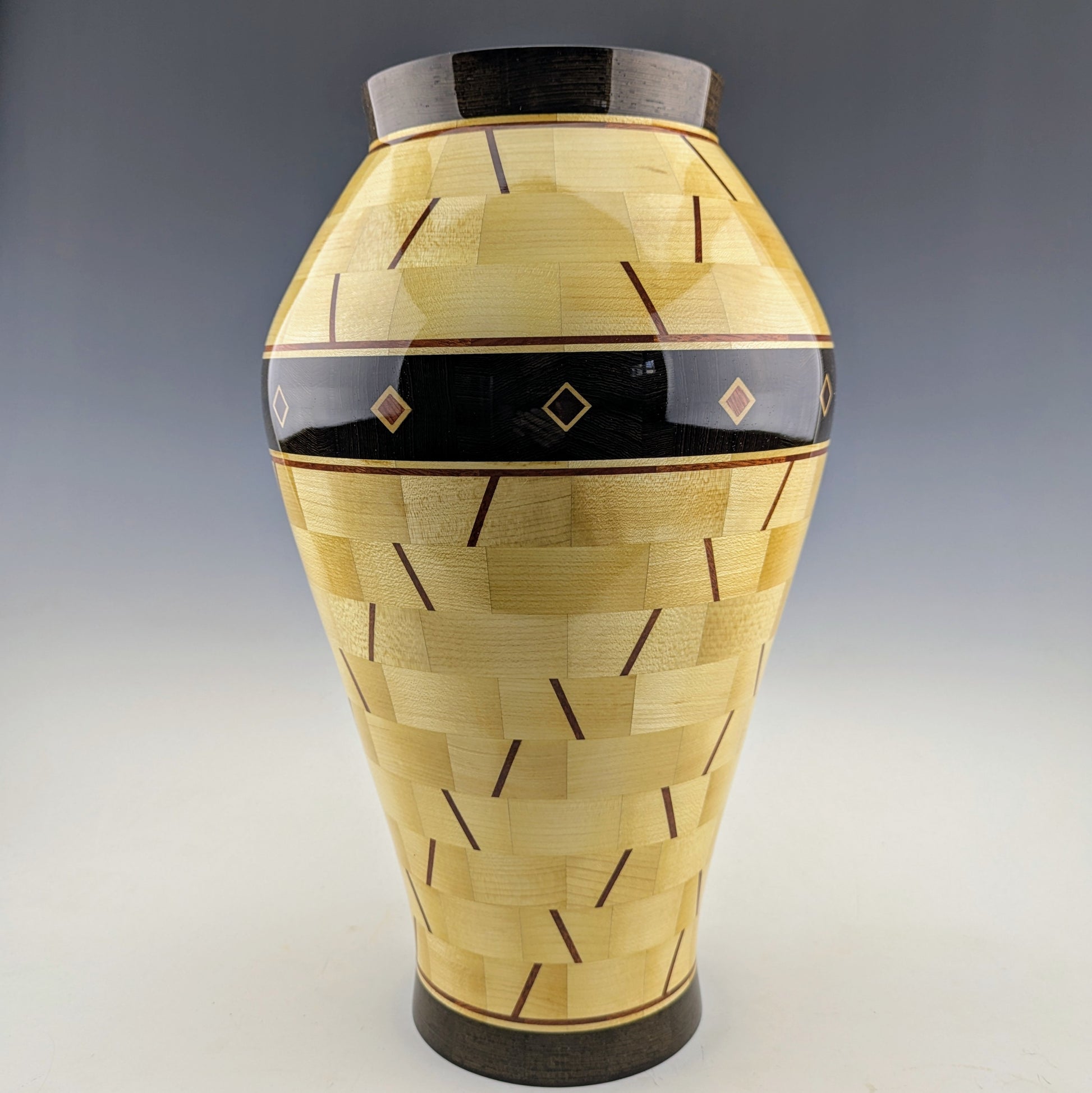 Segmented Vase with a hidden box made of maple, wenge and bloodwood. Designed and crafted in Canada by Simon Roy