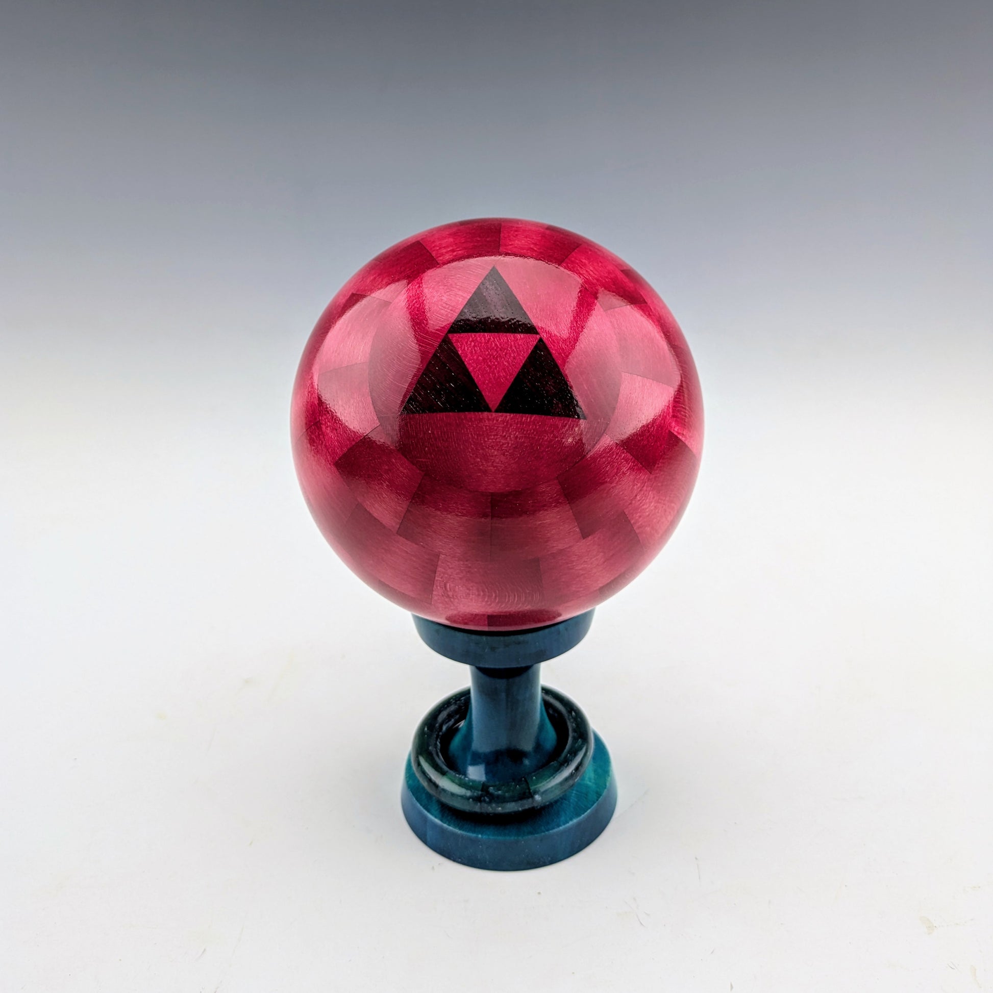 Sphere box made of maple and walnut on  stand with a captive ring. Handcrafted in Canada by roysbox