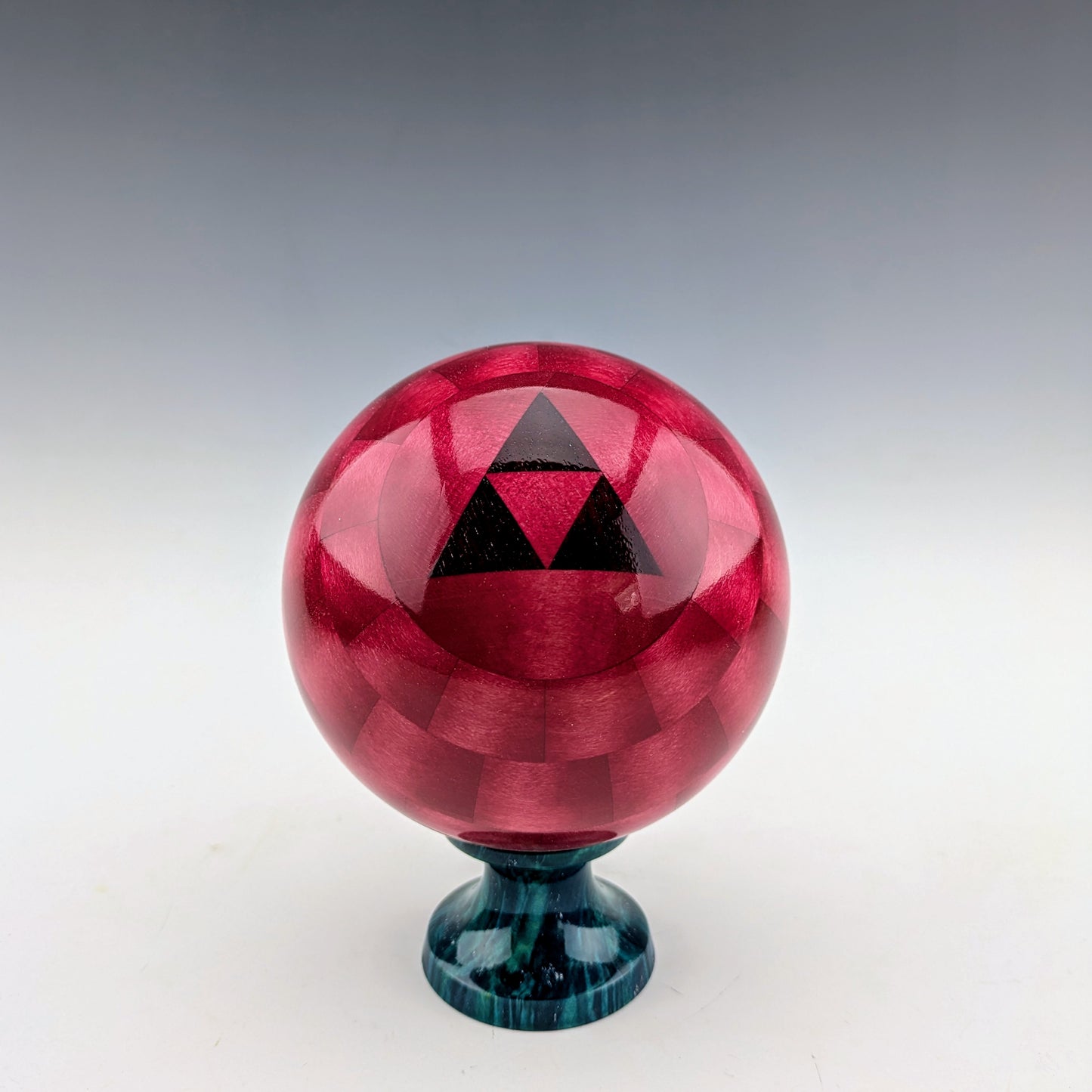 Red Ball Box on a blue burl Stand. Made of maple and walnut. Handcrafted in Canada by roysbox