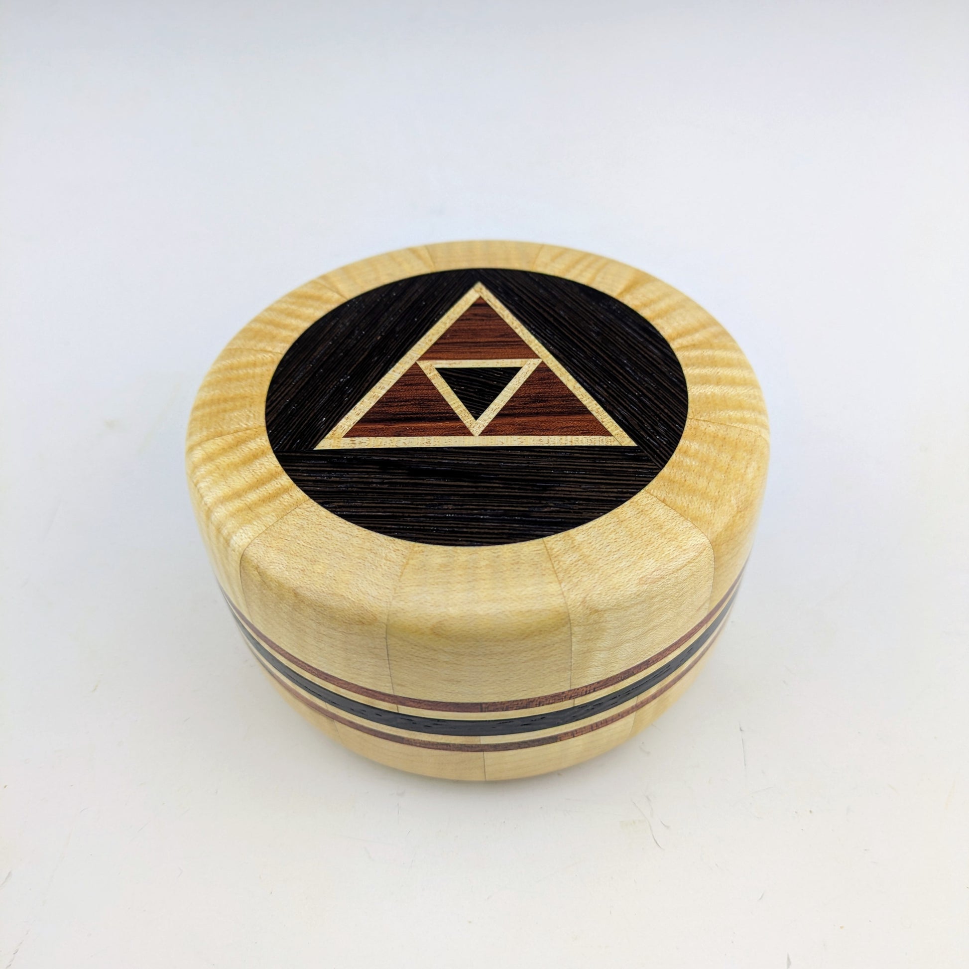 Wooden box made of curly maple, wenge, and bloodwood. Handcrafted in Canada by roysbox