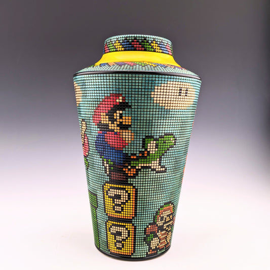 Basket Illusion vase by Simon Roy. Super Mario characters on a pixelized segmented vase made of maple and india ink with a hidden compartment. Handcrafted in Canada. roysbox