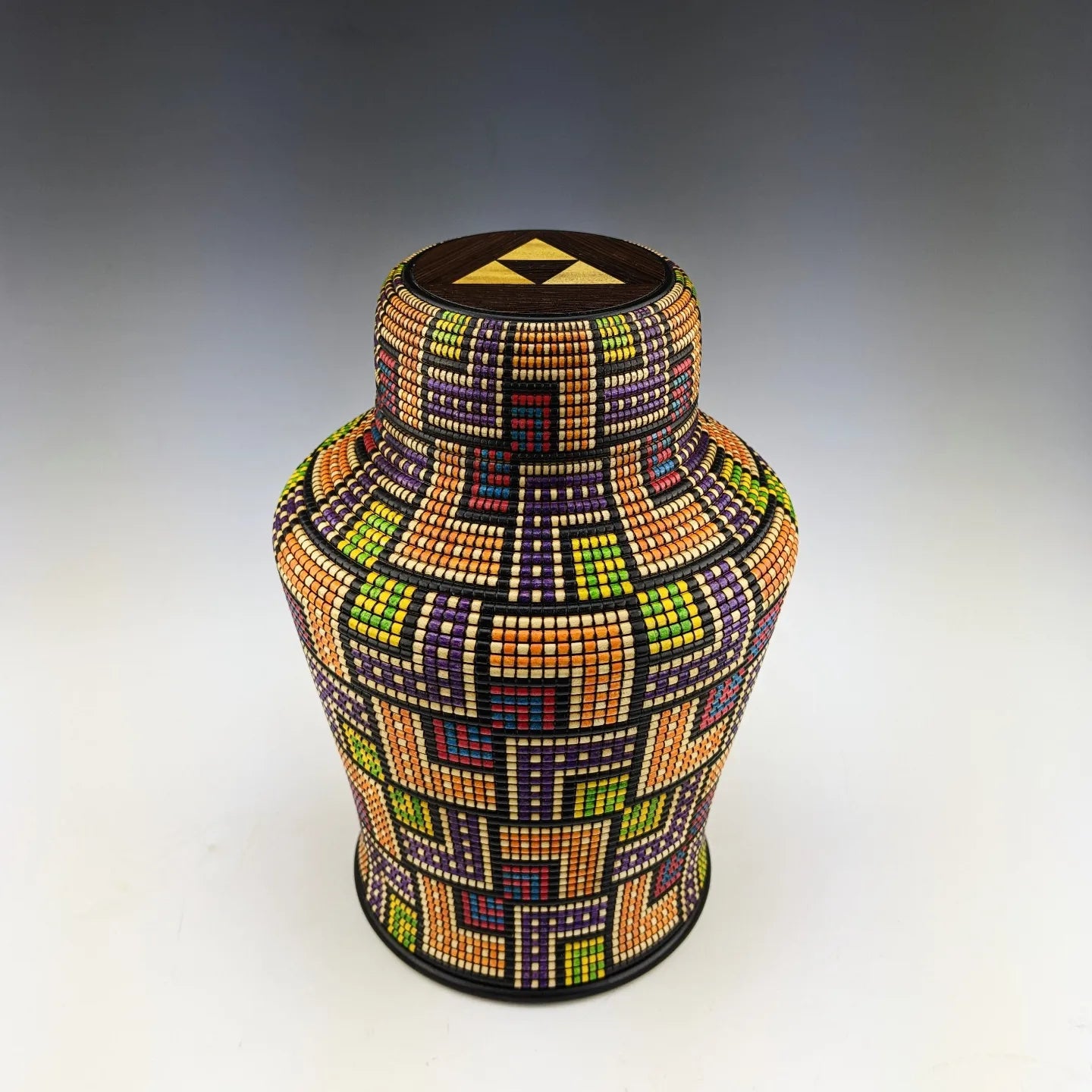 Pixel art vase by Simon Roy. Handmade in canada with maple, wenge, yellowheart and india ink.