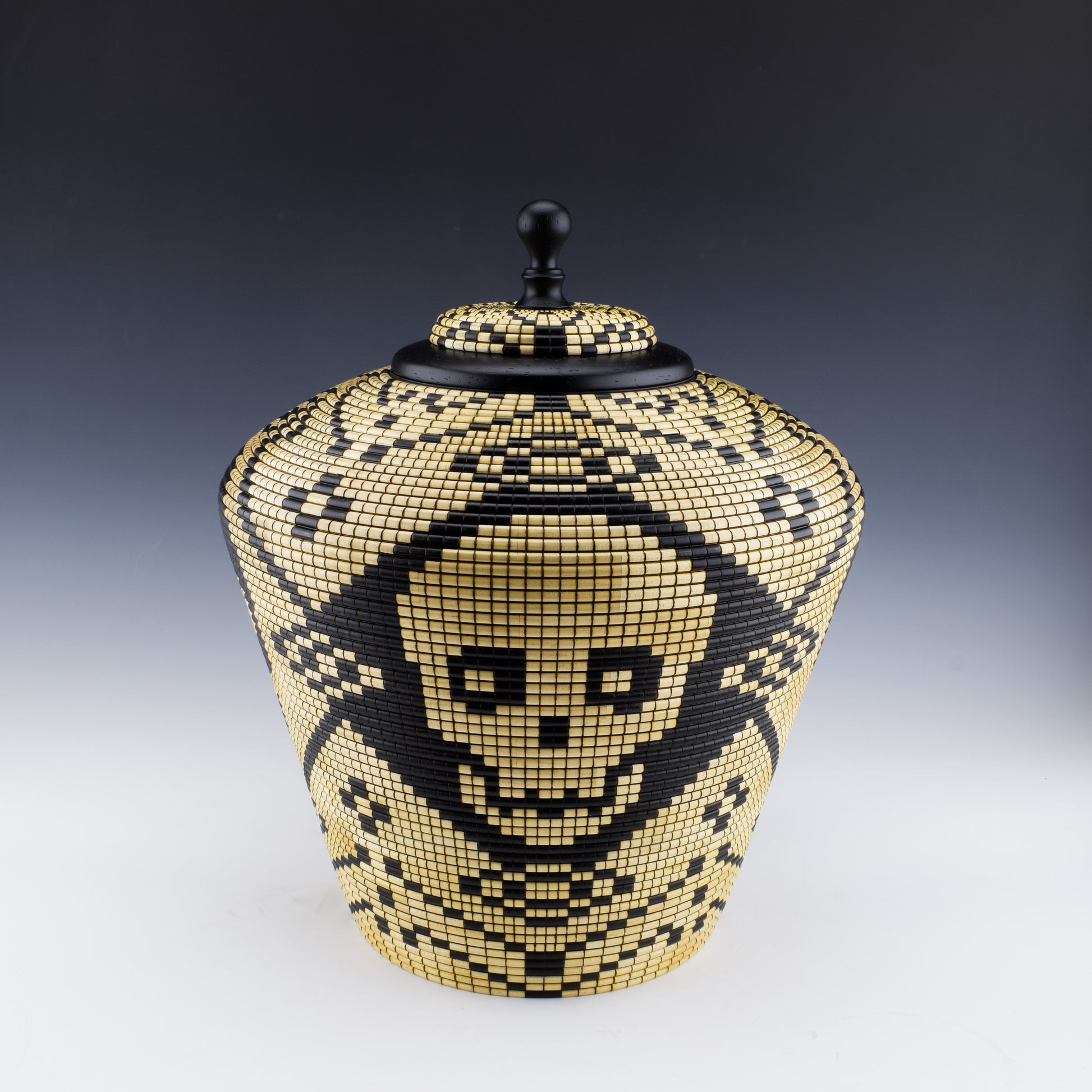 Basket illusion vase with skulls. Handcrafted in Canada  with maple and india ink.