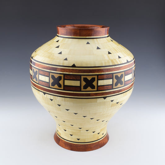 Segmented vase with a hidden box designed and Handcrafted in Canada by Simon Roy. made of curly maple, bloodwood and wenge.